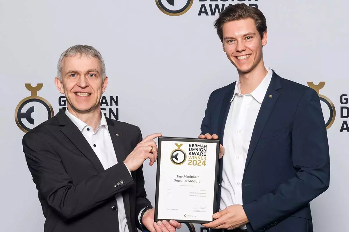 HARTING product managers Heiko Meier and Janek Kolhosser receiving the German Design Award for the Han-Modular Domino modules